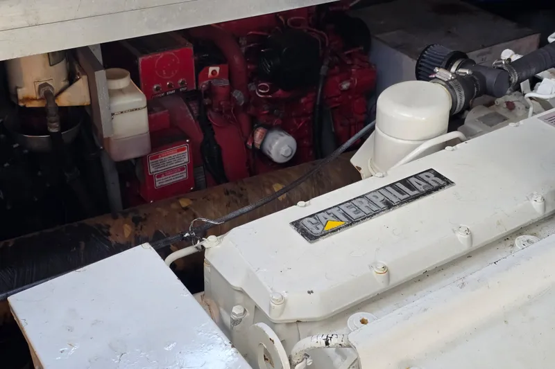 Slide: The Image of Engine compartment of a 1999 Sea Ray Sundancer 400 with Caterpillar components. - 25
