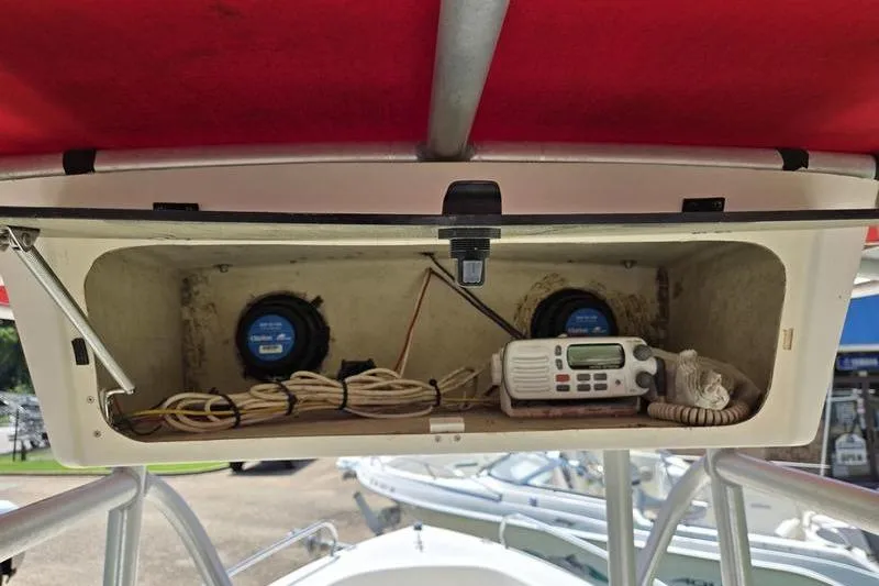 Slide: The Image of Storage compartment on a 2000 May-Craft 2000CC boat with radio and wiring. - 8