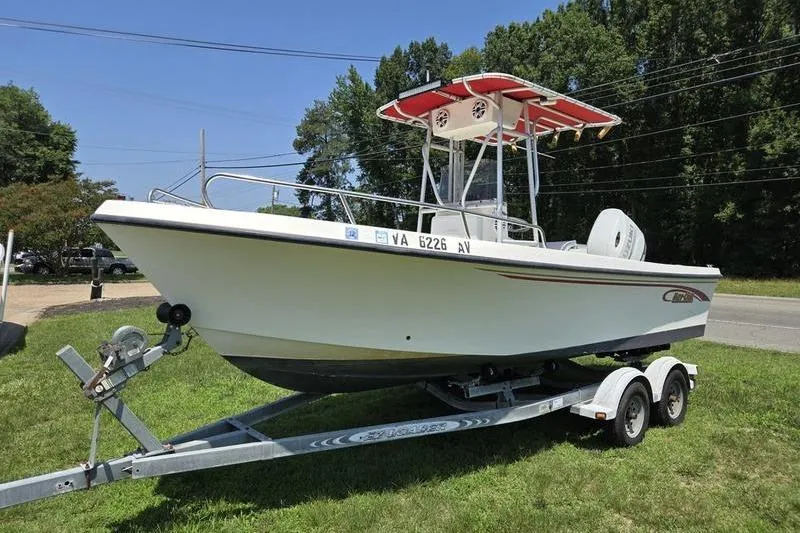 Slide: The Image of 2000 May-Craft 2000CC boat on trailer, parked on grass, sunny day. - 19