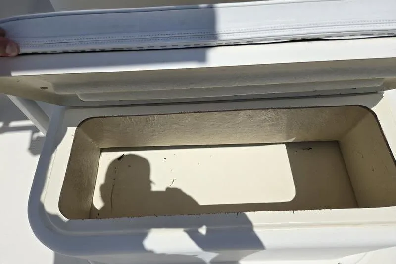 Slide: The Image of Open storage compartment on a 2000 May-Craft 2000CC boat. - 6