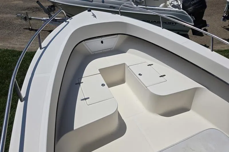 Slide: The Image of 2000 May-Craft 2000CC boat interior with storage compartments and seating. - 5