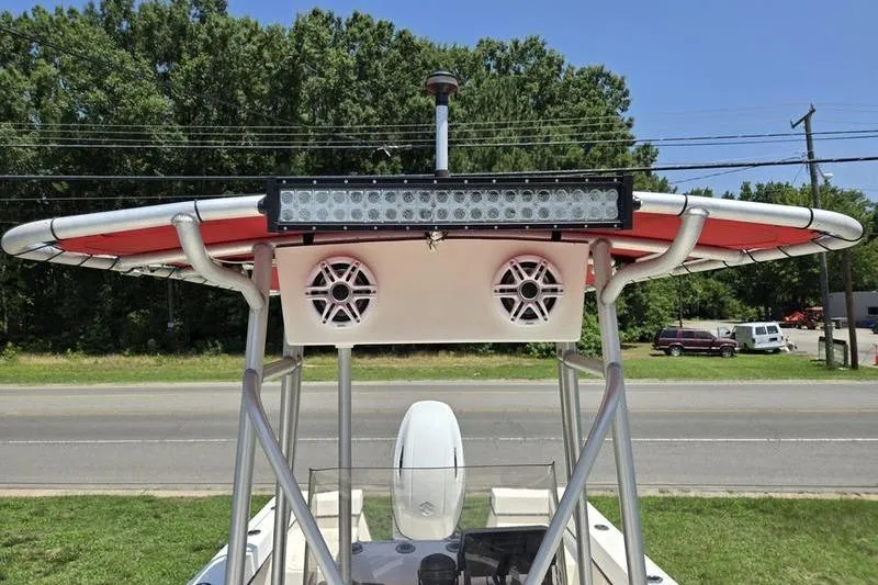 Slide: The Image of 2000 May-Craft 2000CC boat with T-top, speakers, and LED light bar. - 2