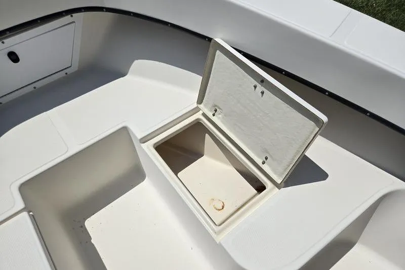 Slide: The Image of Open storage compartment on a 2000 May-Craft 2000CC boat deck. - 4