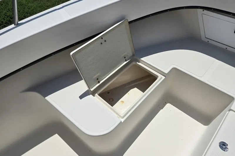 Slide: The Image of Open storage compartment on a 2000 May-Craft 2000CC boat deck. - 20