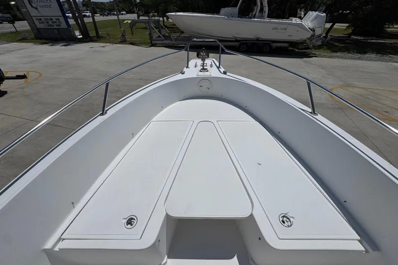 Slide: The Image of 2000 Stamas 250 Tarpon boat deck, featuring spacious seating and sleek design. - 19