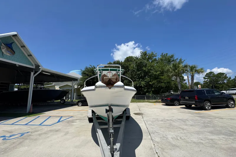 Slide: The Image of 2000 Stamas 250 Tarpon boat on trailer in sunny parking lot. - 6