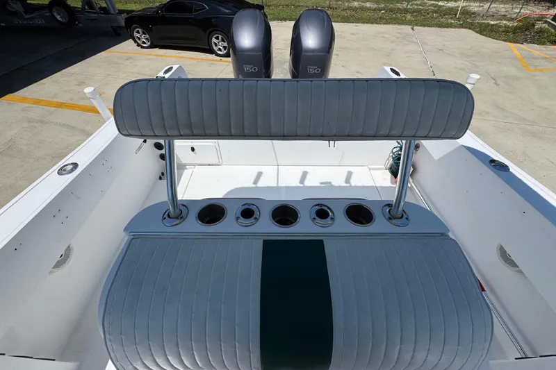 Slide: The Image of 2000 Stamas 250 Tarpon boat interior with seating and dual outboard engines. - 32