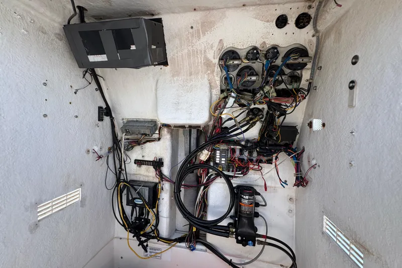 Slide: The Image of Electrical wiring and components inside a 2000 Stamas 250 Tarpon boat. - 29