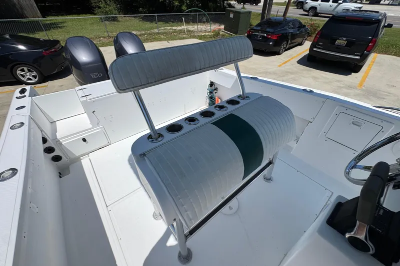 Slide: The Image of 2000 Stamas 250 Tarpon boat interior with seating and dual Yamaha 150 engines. - 33