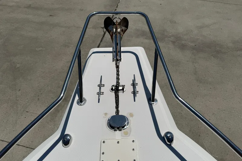 Slide: The Image of Bow of 2000 Stamas 250 Tarpon boat with anchor and railings. - 21