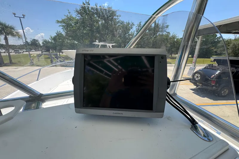 Slide: The Image of Garmin GPSmap 5212 on 2000 Stamas 250 Tarpon boat dashboard, outdoor setting. - 38