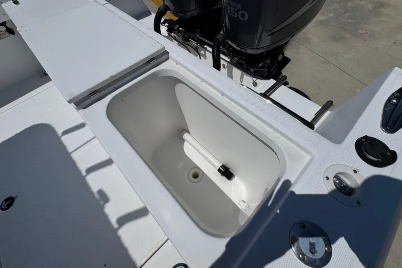Slide: The Image of Open storage compartment on a 2000 Stamas 250 Tarpon boat deck. - 46