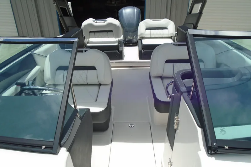 Slide: The Image of 2024 Regal LX4 boat interior with luxurious seating and modern design. - 7