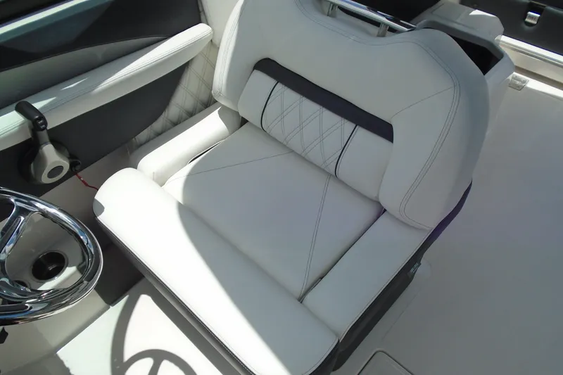 Slide: The Image of Luxurious white seating in 2024 Regal LX4 boat interior. - 10