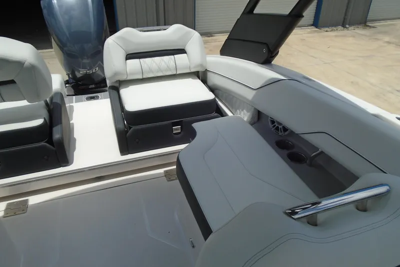 Slide: The Image of 2024 Regal LX4 boat interior with luxurious seating and modern design. - 13