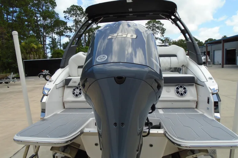 Slide: The Image of 2024 Regal LX4 boat with powerful 250 engine, sleek design, and spacious seating. - 19