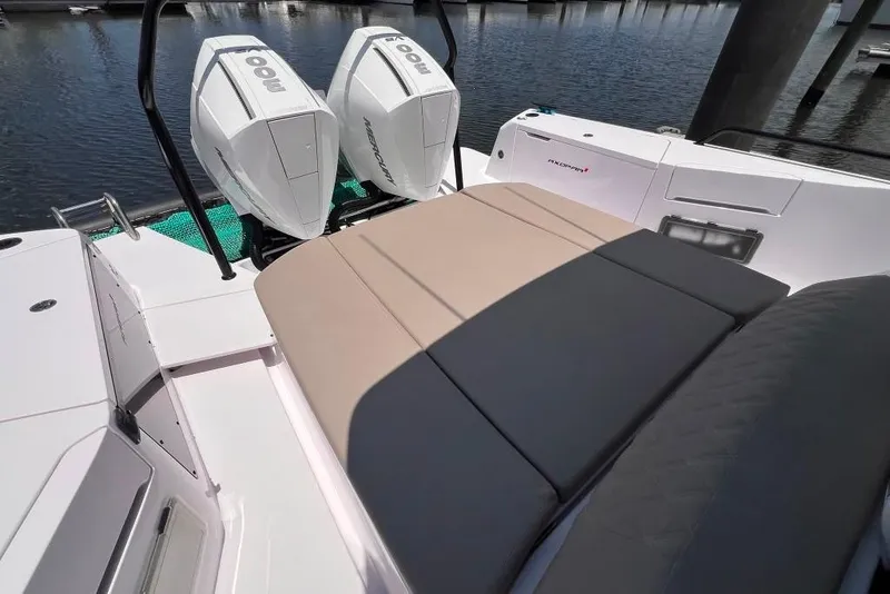Slide: The Image of 2023 Axopar Brabus 37 Sun-Top boat with twin Mercury engines and cushioned seating. - 48