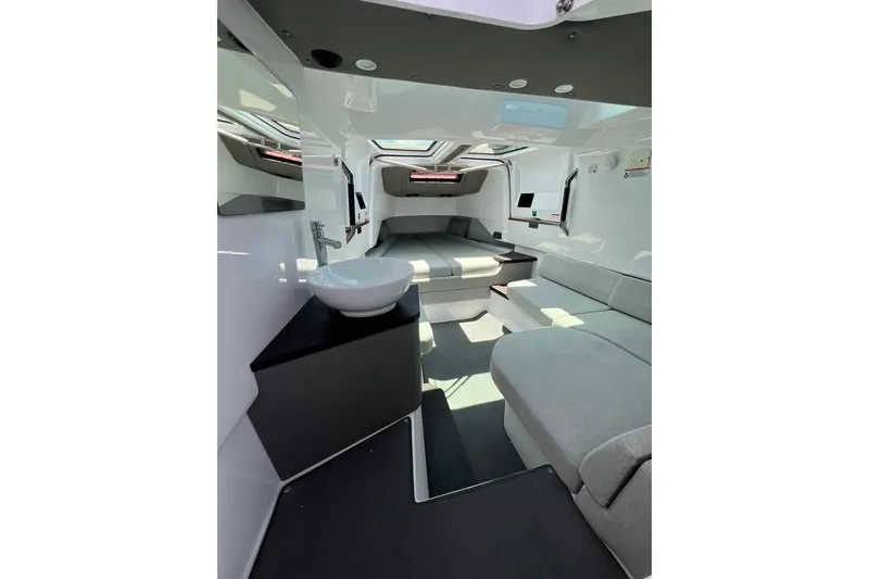 Slide: The Image of Luxurious interior of 2023 Axopar Brabus 37 Sun-Top with modern seating and sleek design. - 20