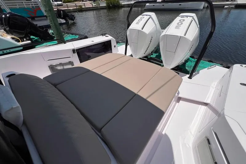 Slide: The Image of 2023 Axopar Brabus 37 Sun-Top boat with dual Mercury engines and cushioned seating. - 49