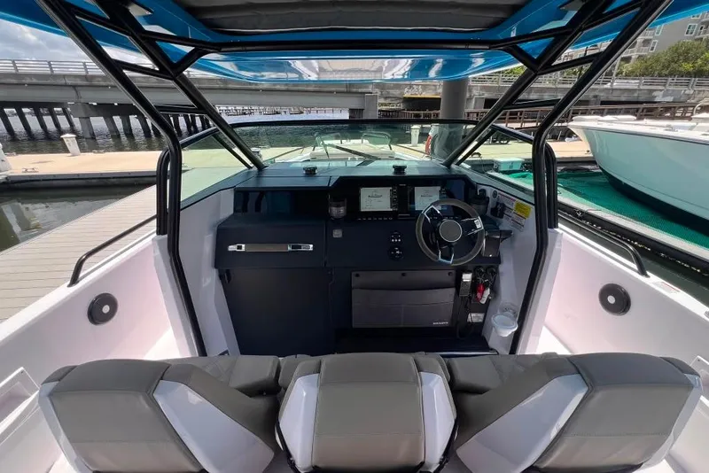 Slide: The Image of 2023 Axopar Brabus 37 Sun-Top boat interior with modern helm and seating. - 56