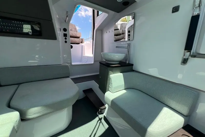 Slide: The Image of Interior of 2023 Axopar Brabus 37 Sun-Top, featuring modern seating and sleek design. - 13