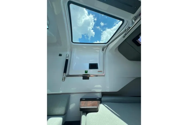 Slide: The Image of Interior view of 2023 Axopar Brabus 37 Sun-Top with skylight and seating. - 14