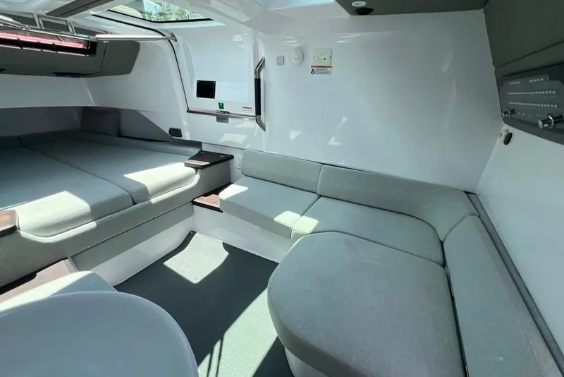 Slide: The Image of Luxurious interior of 2023 Axopar Brabus 37 Sun-Top with modern seating and sleek design. - 26