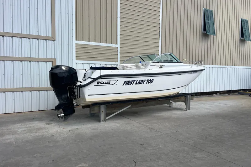 Slide: The Image of 2003 Boston Whaler 210 Ventura boat on stand, labeled "First Lady Too." - 3