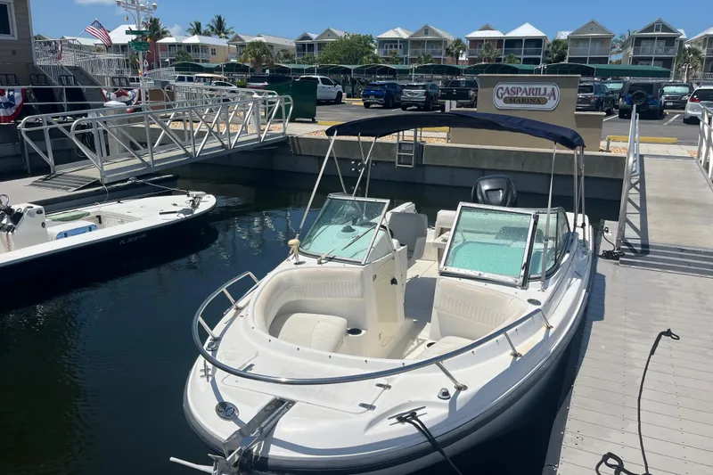 Slide: The Image of 2003 Boston Whaler 210 Ventura docked at Gasparilla Marina under clear skies. - 8