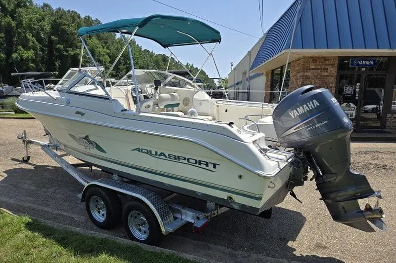 Slide: The Image of 2004 Aquasport 215 Osprey Sport boat on trailer with Yamaha outboard motor. - 18
