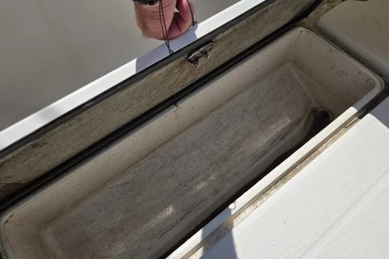 Slide: The Image of Open storage compartment on 2004 Aquasport 215 Osprey Sport boat. - 16
