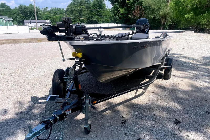 Slide: The Image of 2025 Smoker Craft Freedom 160 TL boat on trailer, parked outdoors on gravel. - 3