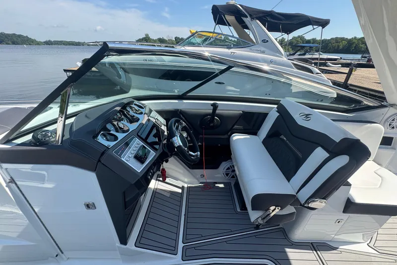 Slide: The Image of 2020 Monterey 298SS Super Sport boat interior with sleek dashboard and comfortable seating. - 6