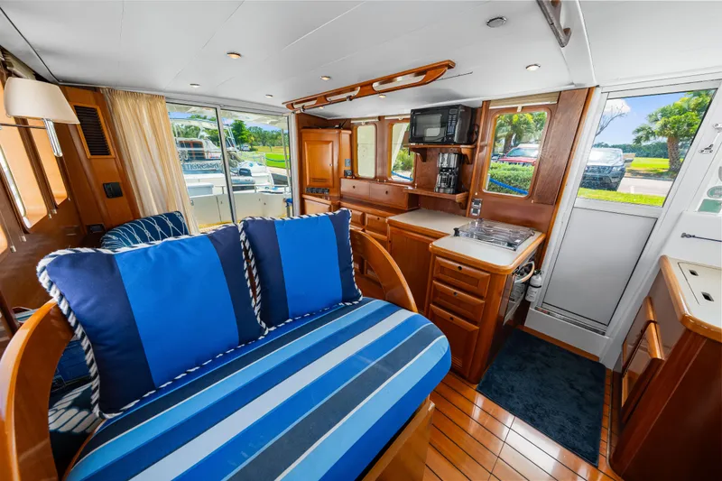 Slide: The Image of Interior of 2006 Beneteau Swift Trawler 42 with cozy seating and modern kitchen amenities. - 72