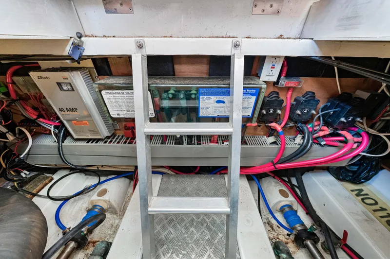 Slide: The Image of Engine room of 2006 Beneteau Swift Trawler 42 with electrical components and wiring. - 81