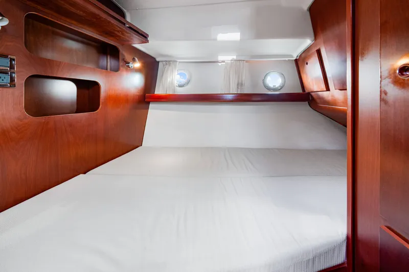Slide: The Image of Luxurious cabin interior of 2006 Beneteau Swift Trawler 42 with wooden finish. - 78