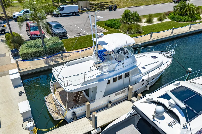 Slide: The Image of 2006 Beneteau Swift Trawler 42 docked at marina, aerial view. - 10