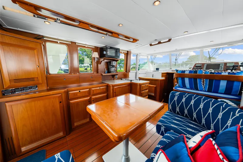 Slide: The Image of Luxurious 2006 Beneteau Swift Trawler 42 interior with elegant wood finish and nautical decor. - 63