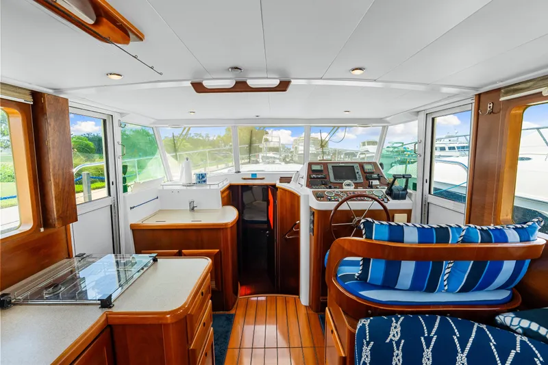 Slide: The Image of Interior of 2006 Beneteau Swift Trawler 42 with wood finish and nautical decor. - 67