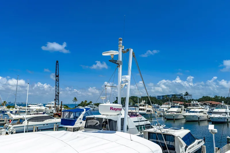 Slide: The Image of Marina with 2006 Beneteau Swift Trawler 42 under clear blue sky. - 22