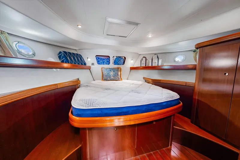 Slide: The Image of Luxurious cabin interior of 2006 Beneteau Swift Trawler 42 with elegant wood finish. - 74