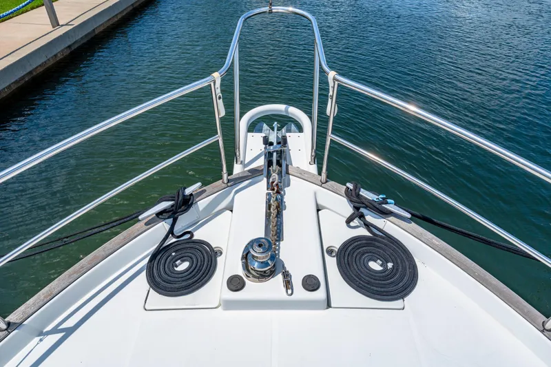 Slide: The Image of Bow view of 2006 Beneteau Swift Trawler 42, featuring anchor and coiled ropes. - 43