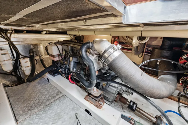 Slide: The Image of Engine room of 2006 Beneteau Swift Trawler 42, showcasing detailed mechanical components. - 80