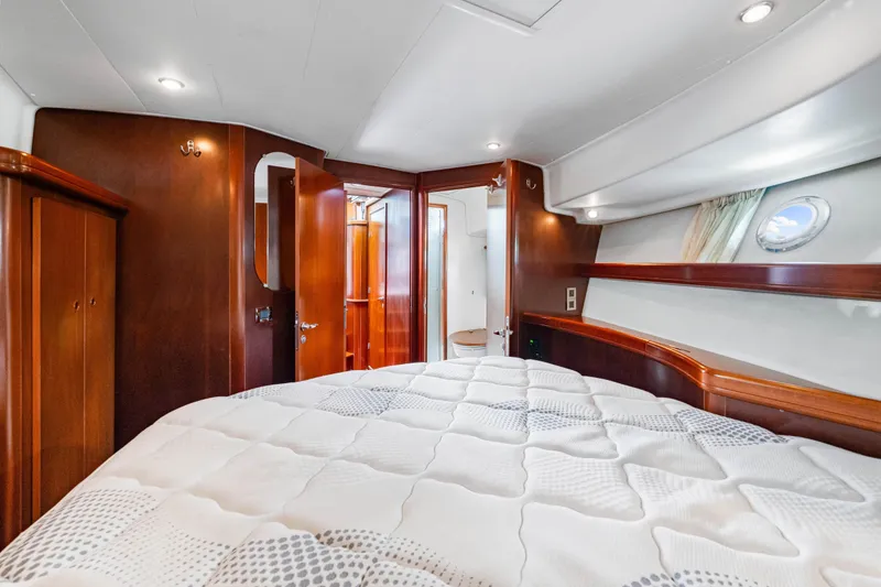 Slide: The Image of Luxurious cabin interior of 2006 Beneteau Swift Trawler 42 with elegant wood finishes. - 75