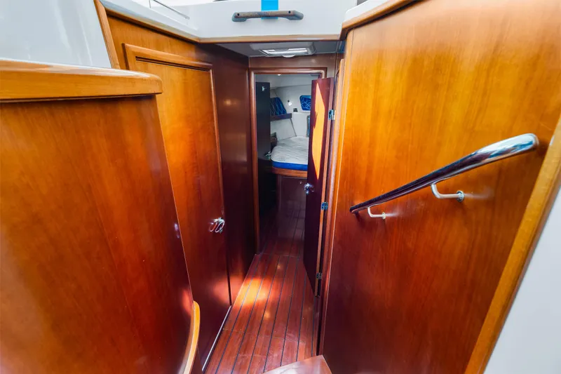 Slide: The Image of Interior hallway of 2006 Beneteau Swift Trawler 42 with wooden finishes and cozy cabin. - 73