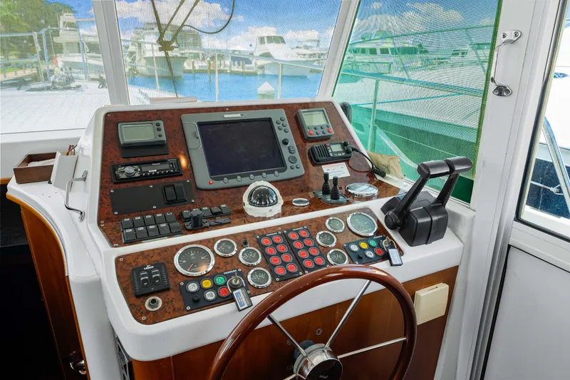 Slide: The Image of Helm station of 2006 Beneteau Swift Trawler 42 with navigation instruments and controls. - 71