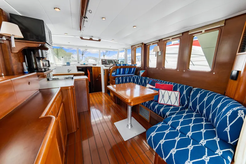 Slide: The Image of Luxurious interior of 2006 Beneteau Swift Trawler 42 with elegant wood finishes and nautical decor. - 61