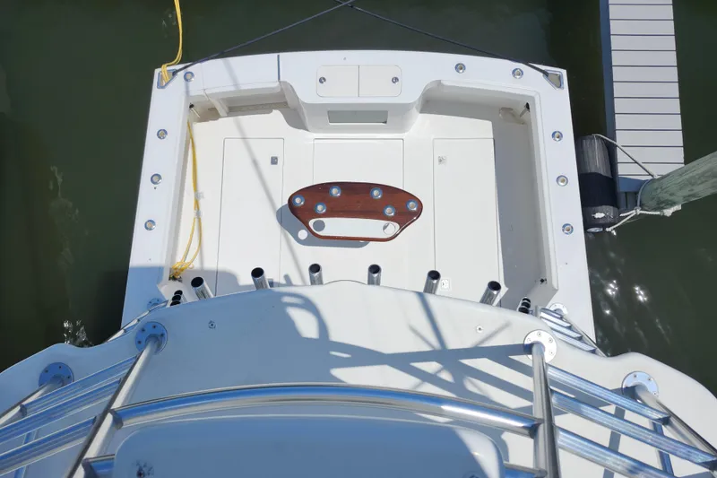 Slide: The Image of Overhead view of 2009 Cabo 36 Express boat deck at dock. - 17