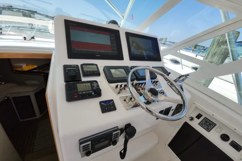 Slide: The Image of Helm of 2009 Cabo 36 Express boat with navigation equipment and steering wheel. - 8