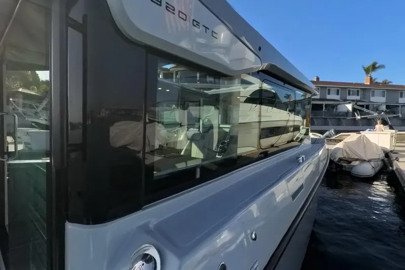 Slide: The Image of 2024 Saxdor 320 GTC yacht docked, showcasing sleek design and modern features. - 52